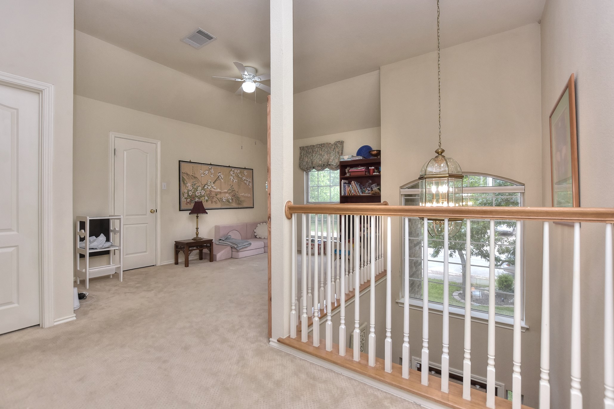 1609 Colton Way Cedar Park, TX 78613 - Photo 23 of 24 A graceful staircase with a classic railing design offers a welcoming transition to the upper level.