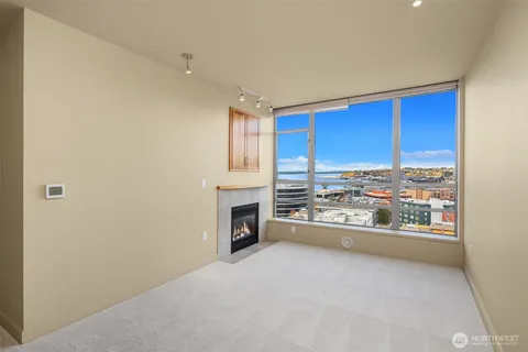 a view of open kitchen with a sink and a refrigerator