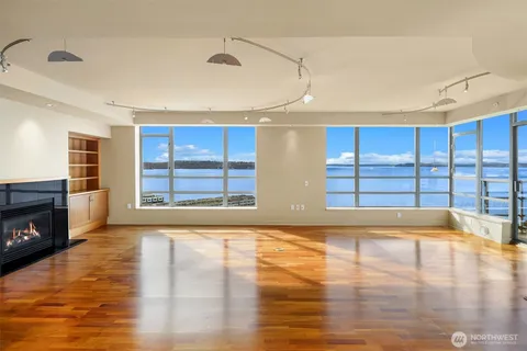 a view of livingroom with hardwood floor and a fireplace
