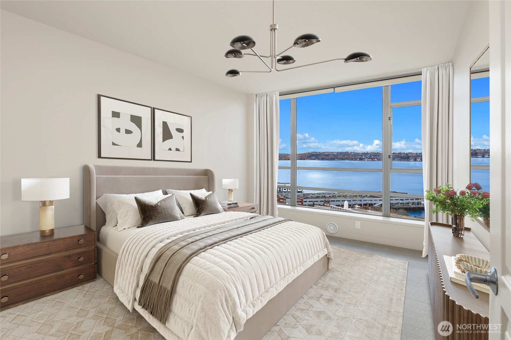 2929 1st Avenue, Unit 1200 Seattle, WA 98121 - Photo 8 of 23 a bedroom with a large bed and a chandelier