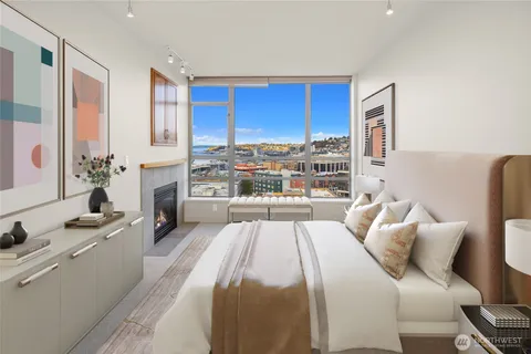 a large bedroom with a bed and a large window