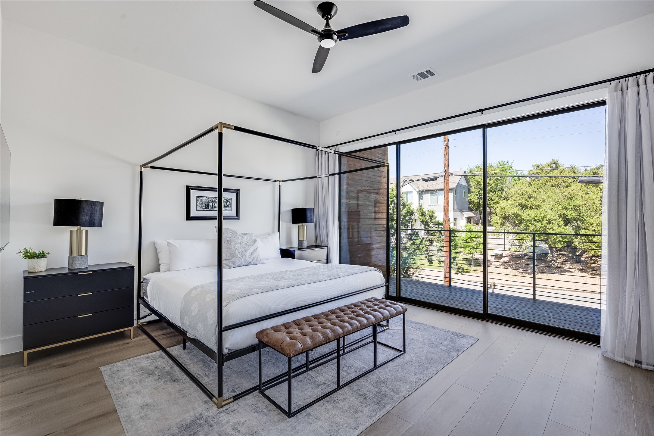 3138 Chisholm Trail Austin, TX 78734 - Photo 19 of 40 a bedroom with a bed and large window