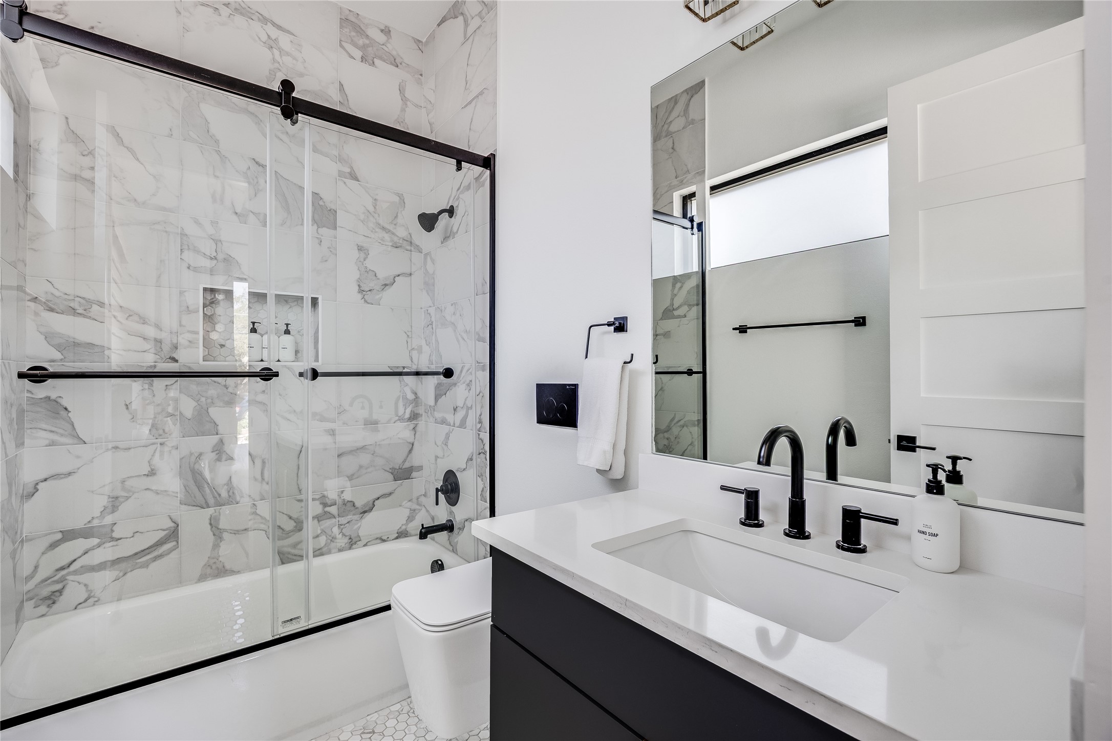 3138 Chisholm Trail Austin, TX 78734 - Photo 20 of 40 a bathroom with a sink and a mirror