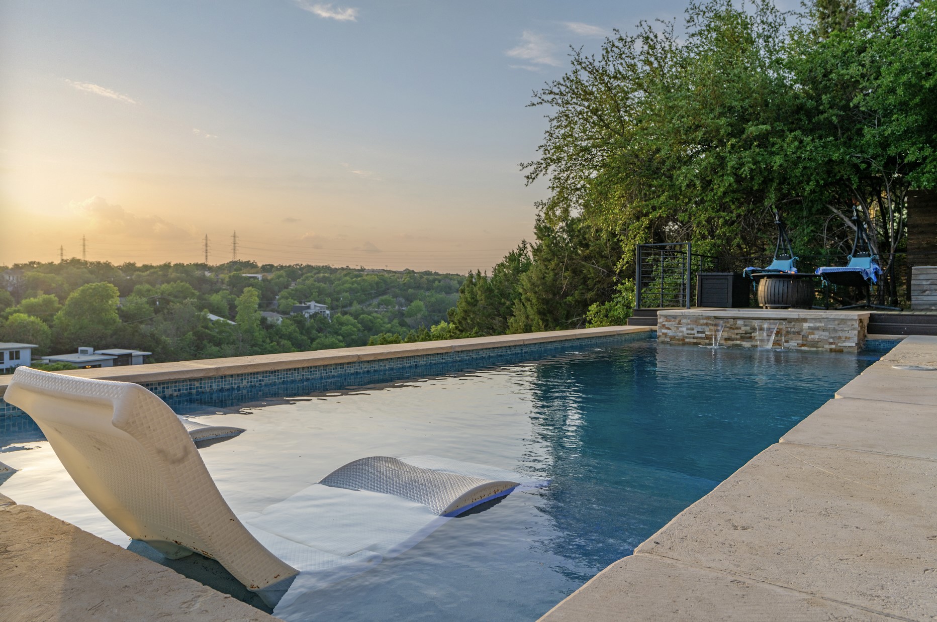 3138 Chisholm Trail Austin, TX 78734 - Photo 34 of 40 a view of a swimming pool with a lounge chair