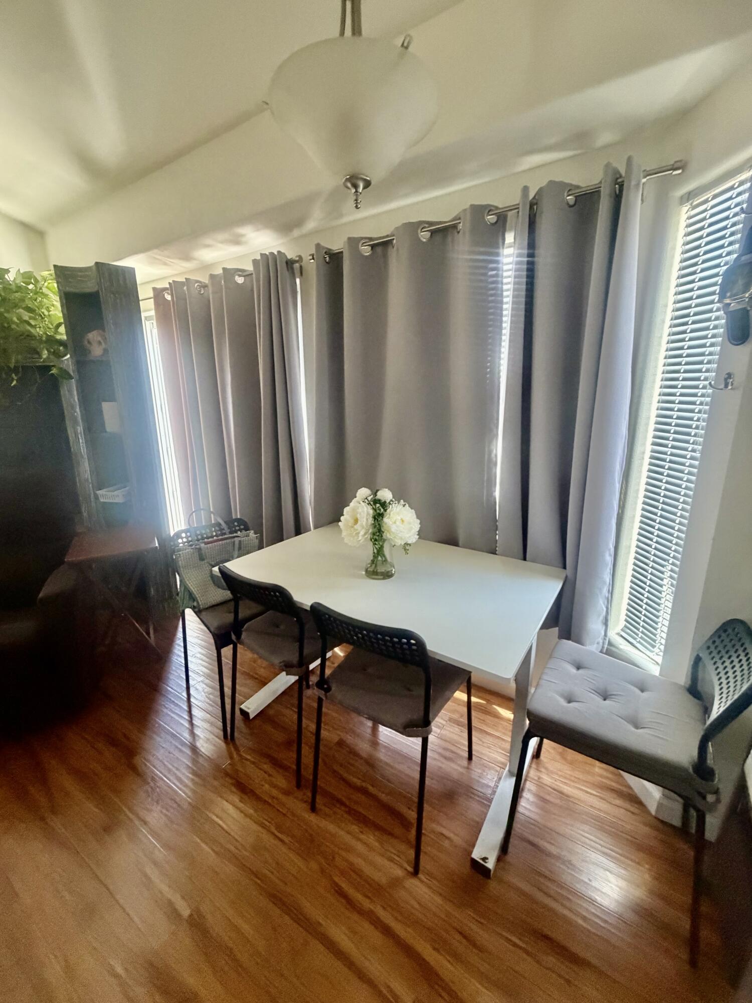 74711 Dillon Road, Unit 264 Desert Hot Springs, CA 92241 - Photo 16 of 21 a view of a dining room with furniture window and wooden floor