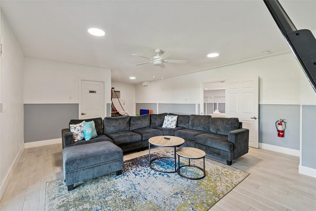 330 6th Avenue Indian Rocks Beach, FL 33785 - Photo 24 of 52 a living room with furniture and a couch