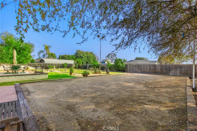 swimming pool view with a seating space