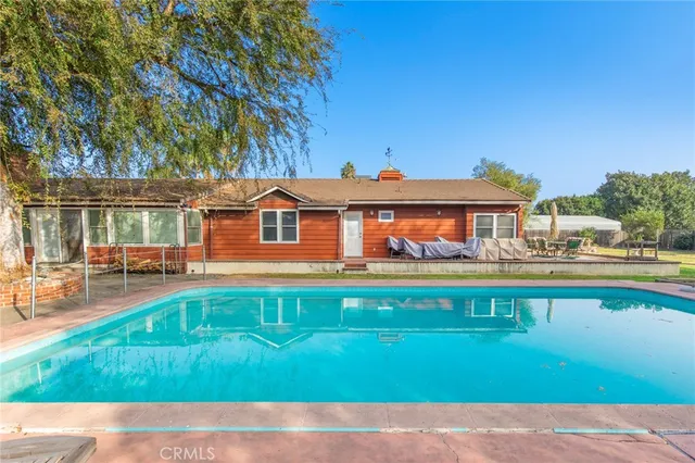 a view of a house with swimming pool