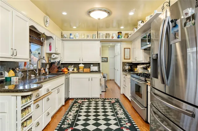 a view of a dining room with furniture and a chandelier