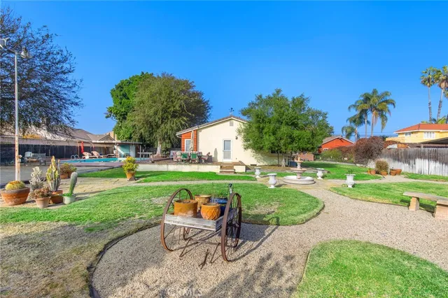 a view of a backyard with sitting area
