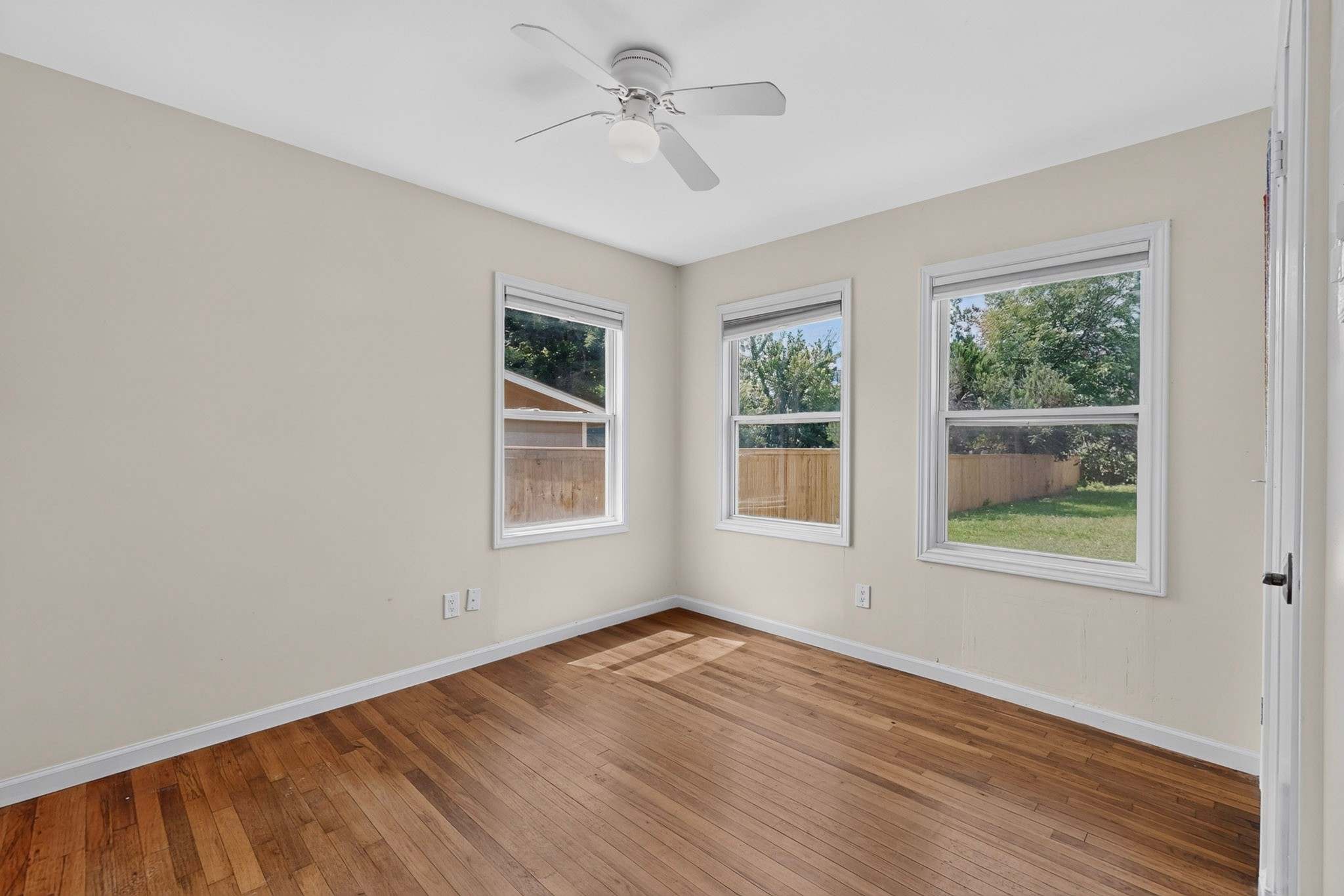 4711 Alf Avenue Austin, TX 78721 - Photo 23 of 34 BR2 - Naturally illuminated interiors features hardwood floors and backyard view