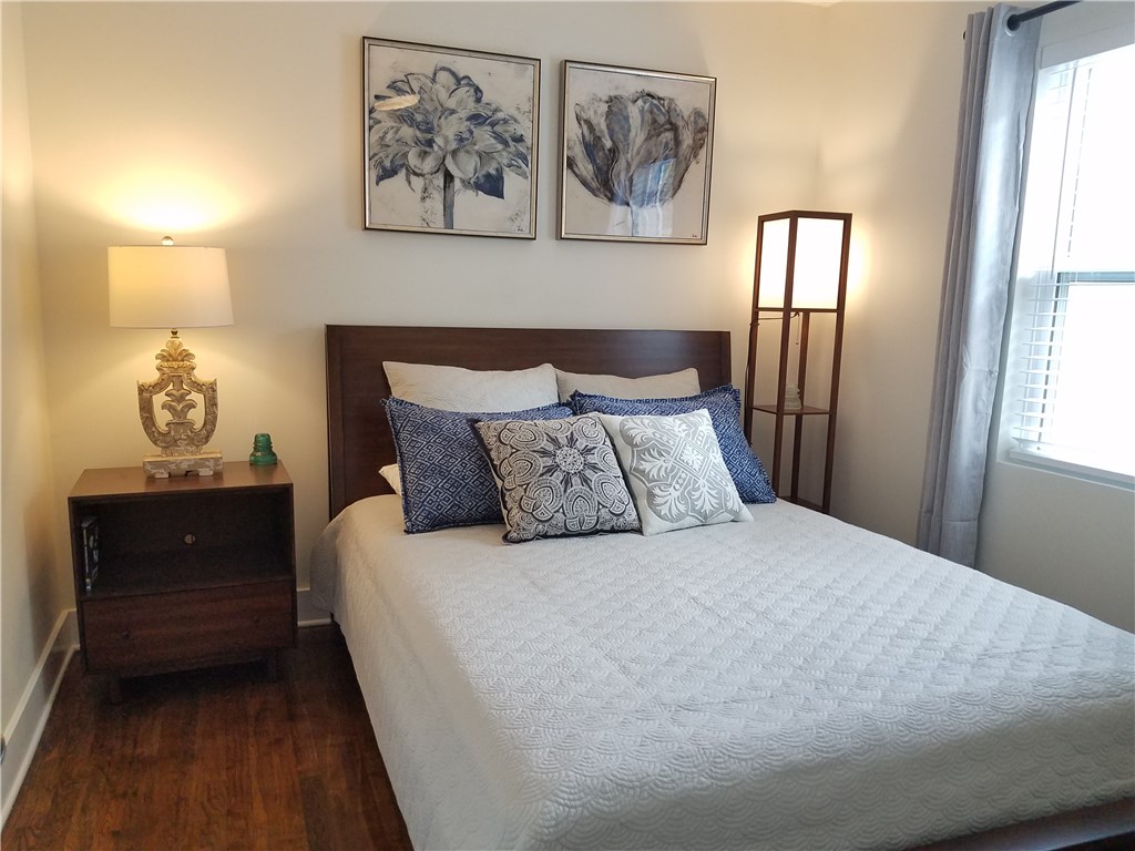 5405 Hudson Street Austin, TX 78721 - Photo 23 of 37 Hardwood floors and generous lighting create a warm and inviting sleeping space.