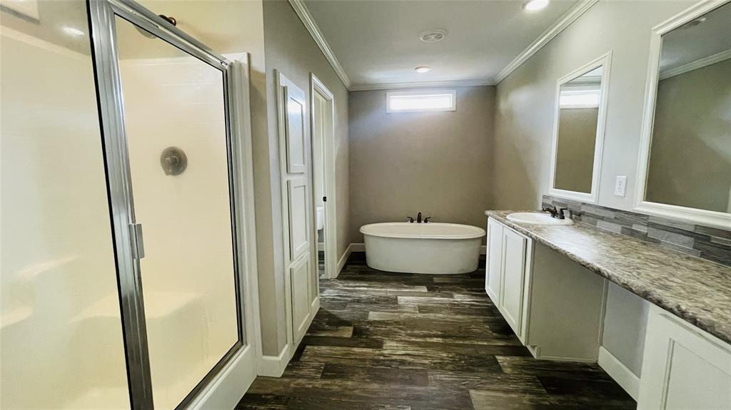 8394 Lake Road Mansfield, TX 76063 - Photo 20 of 22 a bathroom with a granite countertop sink toilet and shower