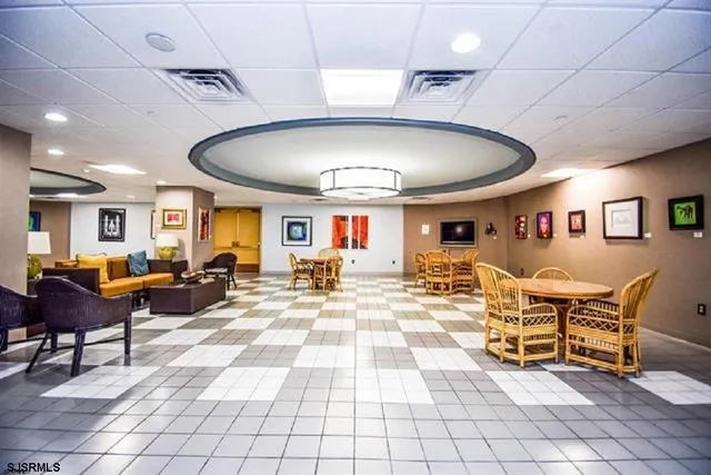 a view of a living room and kitchen