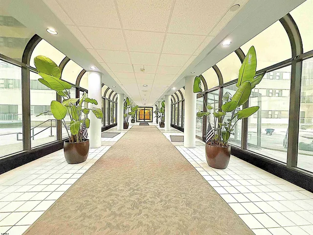 a bathroom with a shower and a mirror