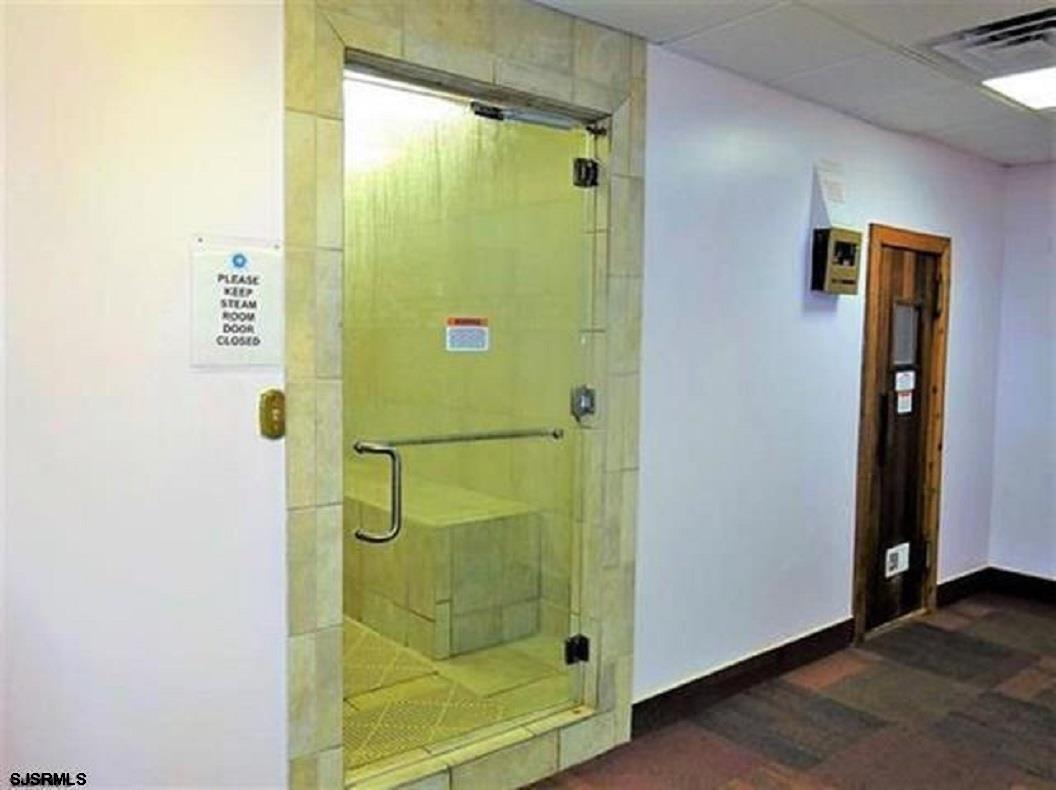 3101 Boardwalk, Unit 1402A1 Atlantic City, NJ 08401 - Photo 23 of 31 a bathroom with a shower and a mirror