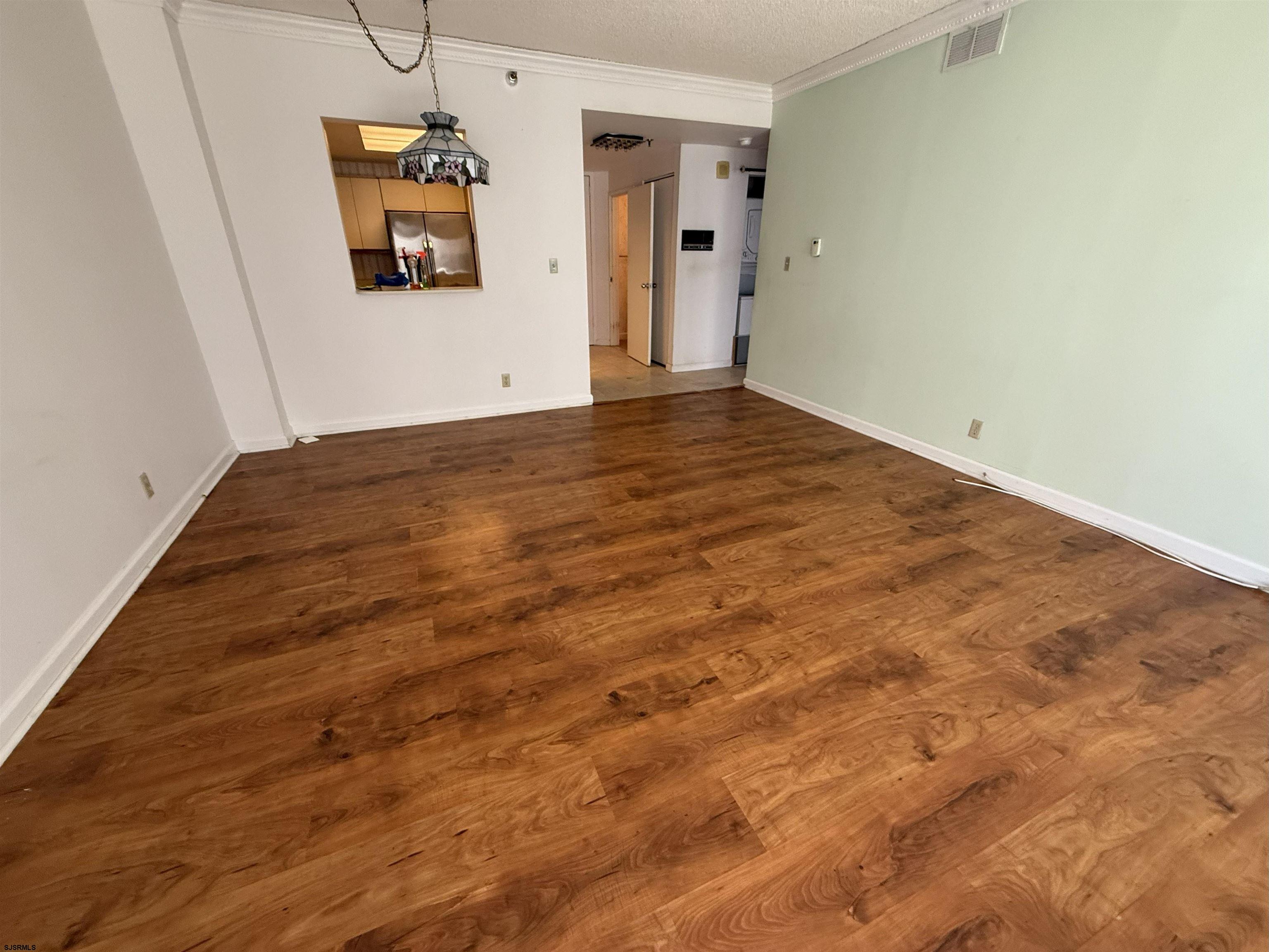 3101 Boardwalk, Unit 1402A1 Atlantic City, NJ 08401 - Photo 3 of 31 a view of empty room with wooden floor