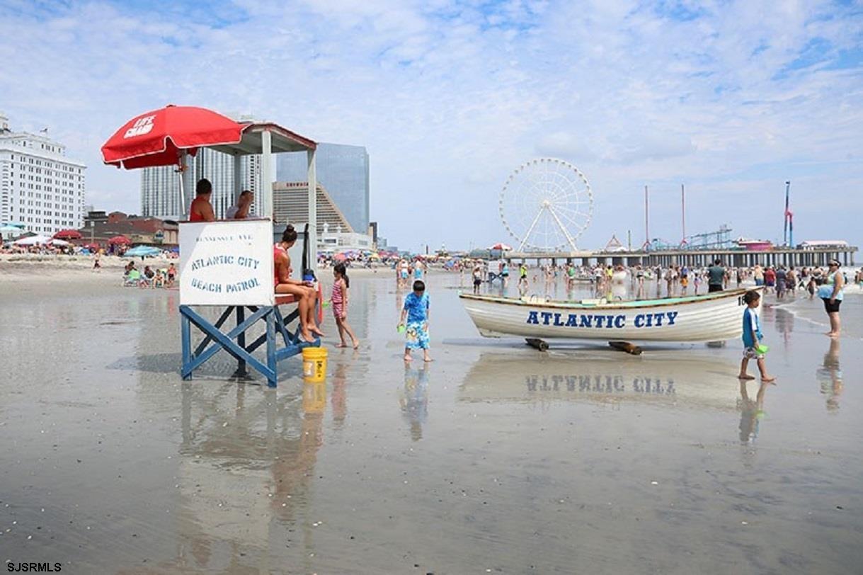 3101 Boardwalk, Unit 1402A1 Atlantic City, NJ 08401 - Photo 31 of 31 a view of a patio with a table and chairs under an umbrella