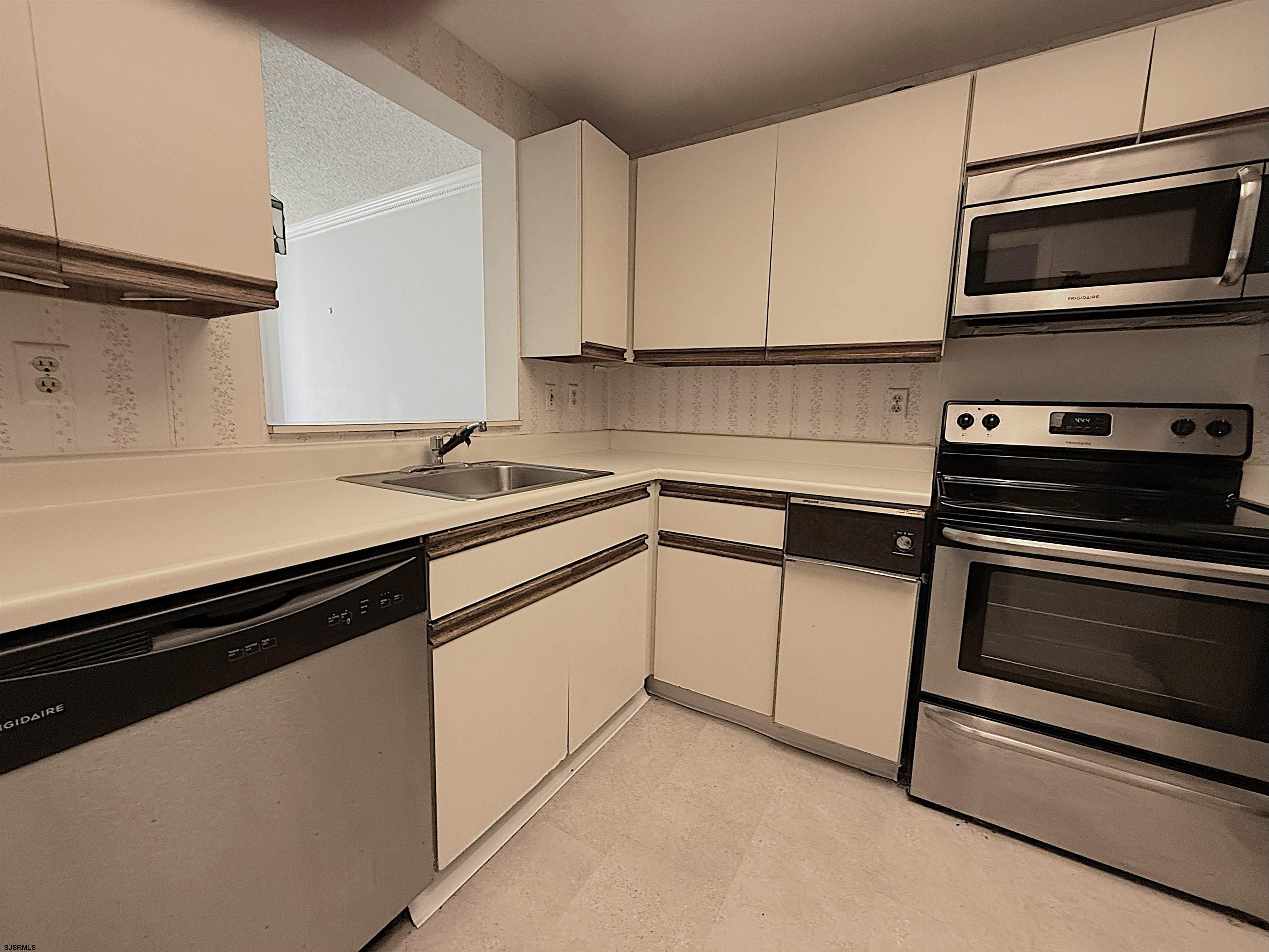 3101 Boardwalk, Unit 1402A1 Atlantic City, NJ 08401 - Photo 6 of 31 a kitchen with appliances cabinets and a sink