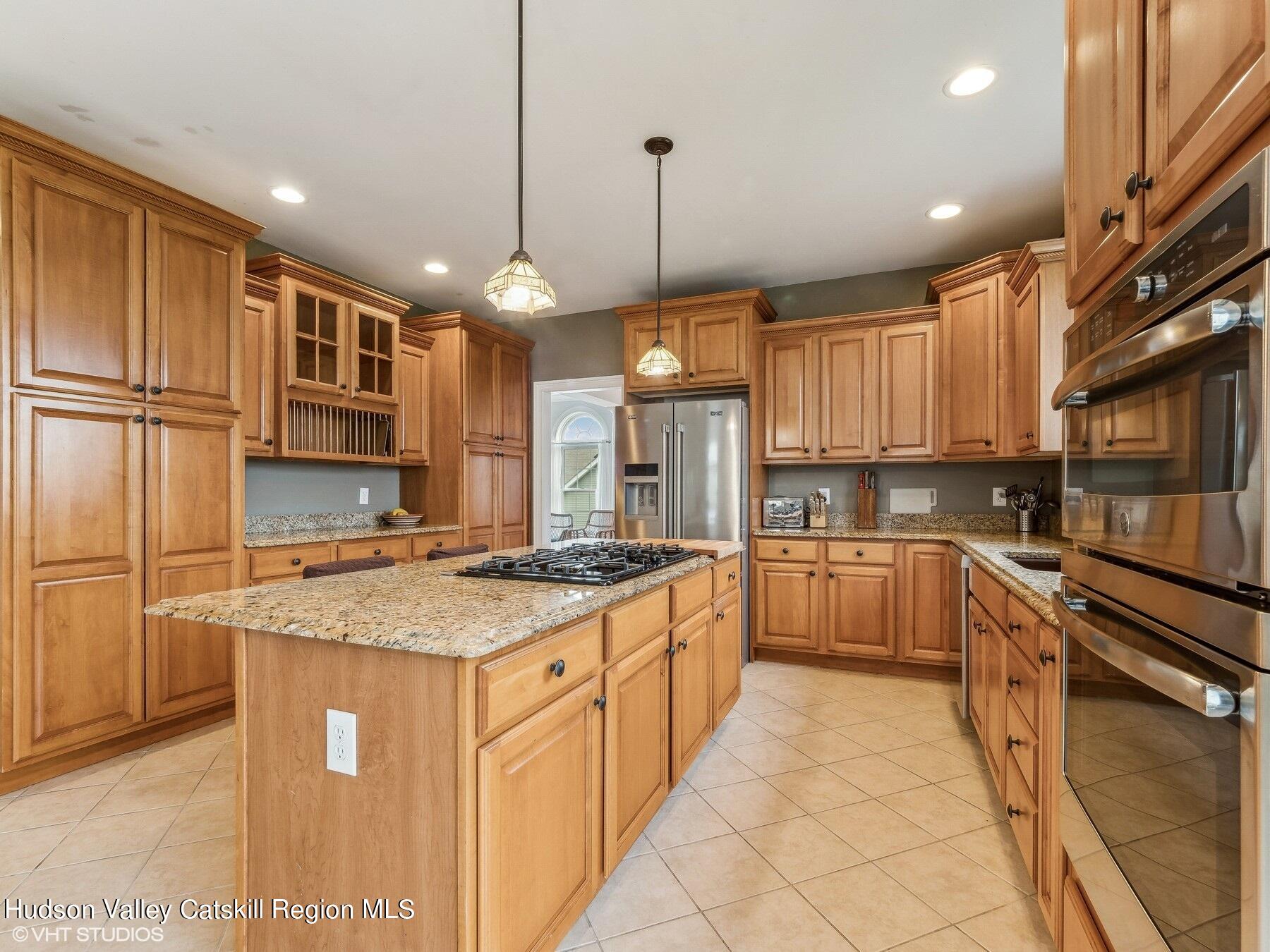 39 Ridgeline Drive Poughkeepsie, NY 12603 - Photo 11 of 35 a kitchen with stainless steel appliances granite countertop a sink stove and refrigerator