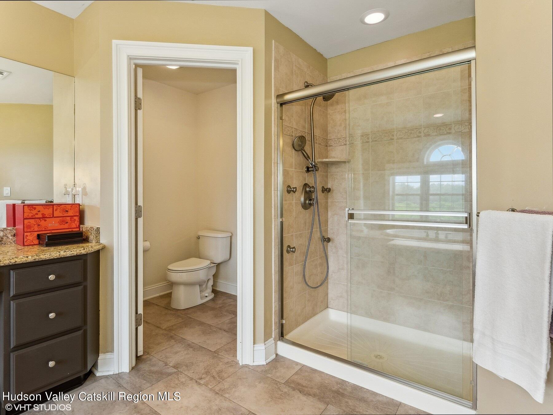 39 Ridgeline Drive Poughkeepsie, NY 12603 - Photo 23 of 35 a bathroom with a granite countertop toilet sink and shower