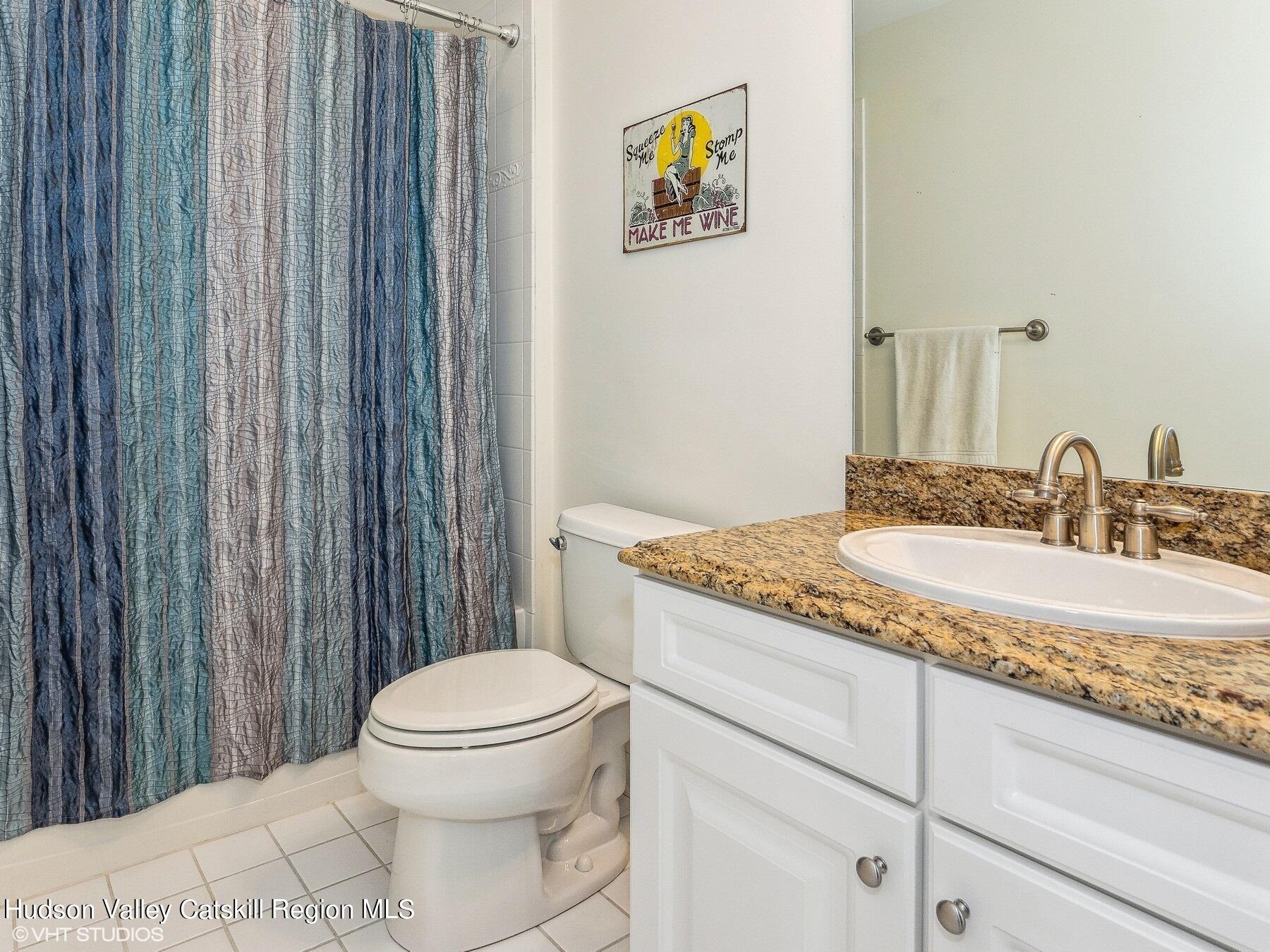 39 Ridgeline Drive Poughkeepsie, NY 12603 - Photo 27 of 35 a bathroom with a granite countertop sink a toilet and a mirror