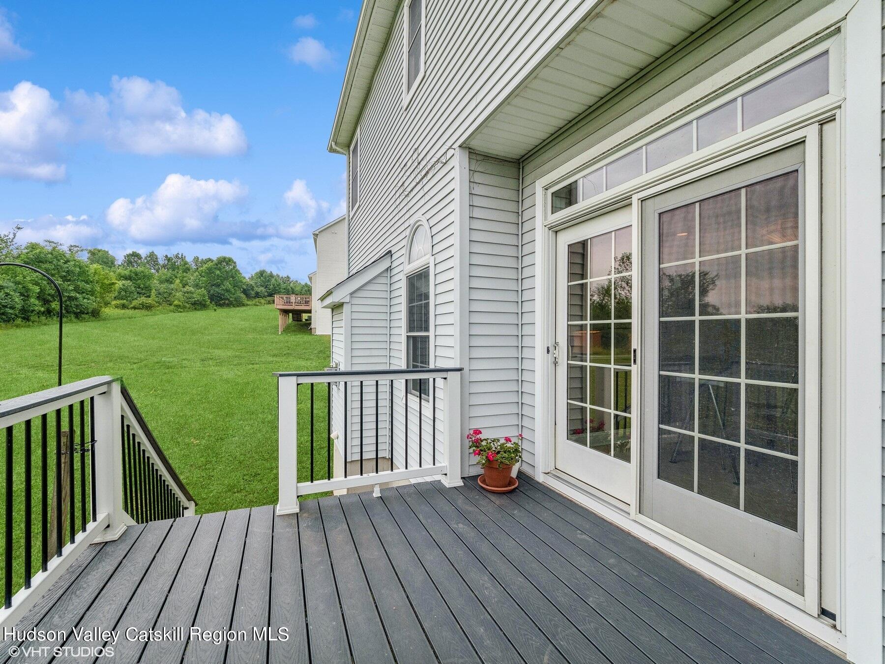 39 Ridgeline Drive Poughkeepsie, NY 12603 - Photo 30 of 35 a view of a deck with wooden floor and fence