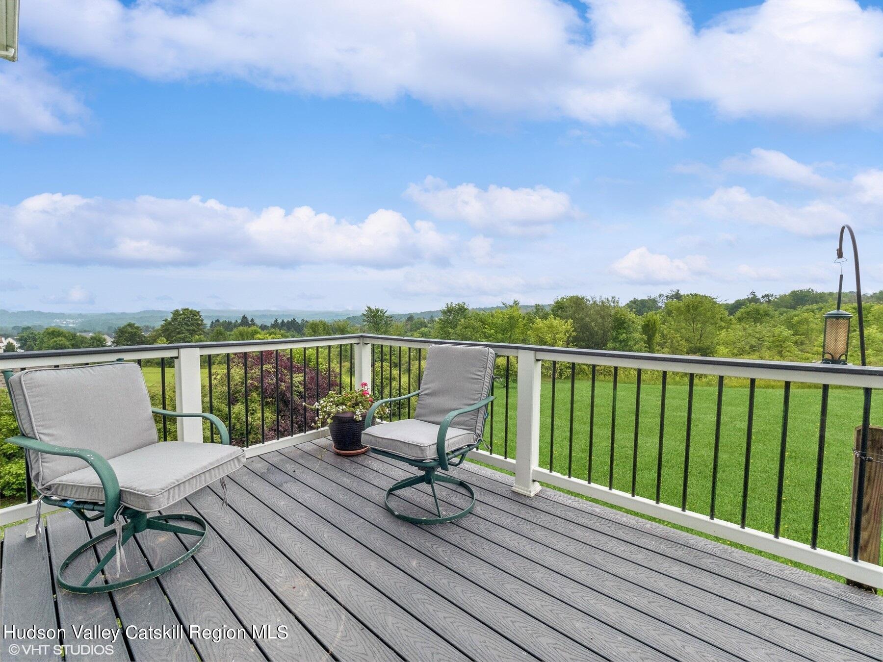 39 Ridgeline Drive Poughkeepsie, NY 12603 - Photo 31 of 35 a view of roof deck with two chairs and wooden floor