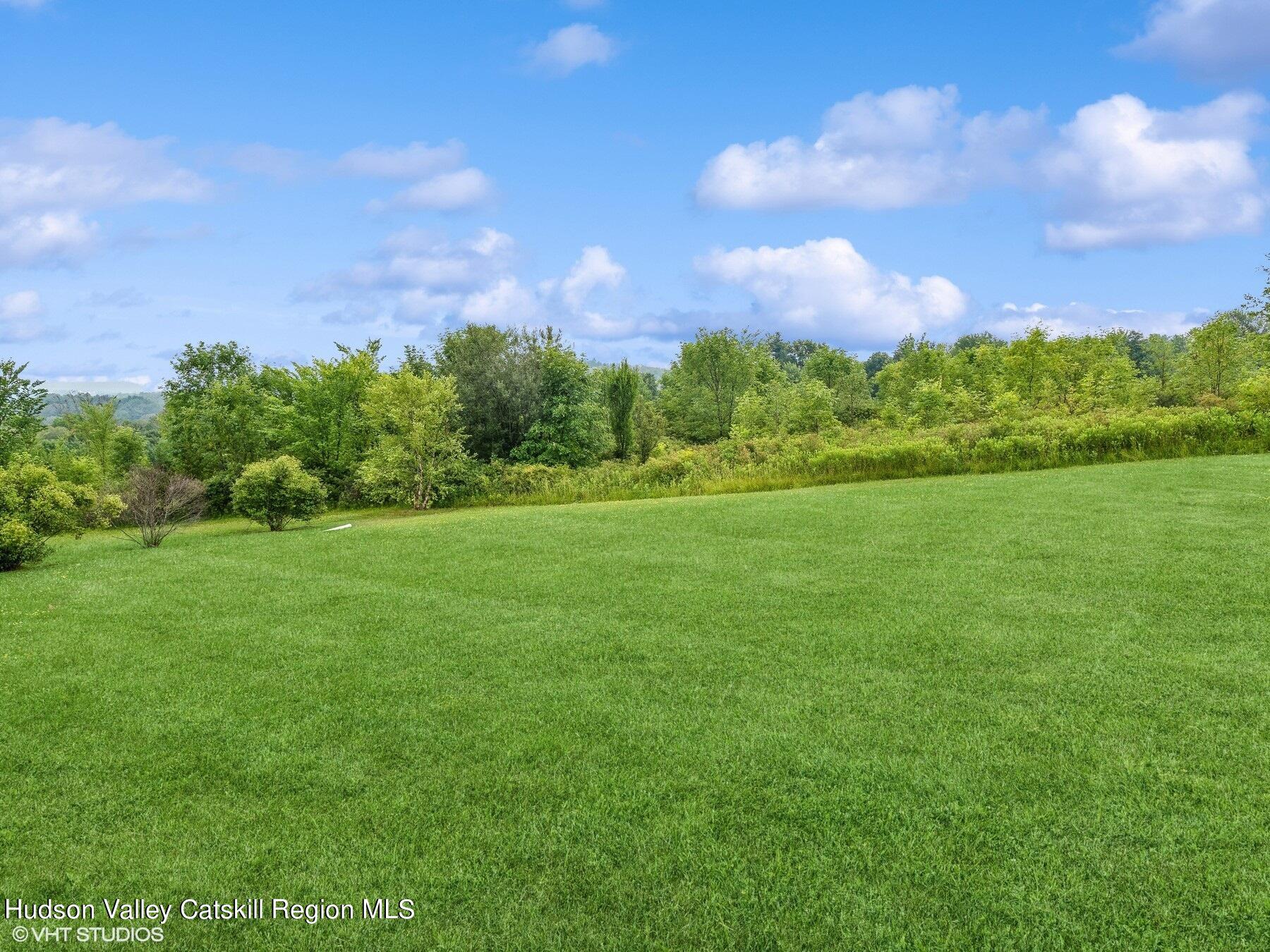 39 Ridgeline Drive Poughkeepsie, NY 12603 - Photo 32 of 35 a view of a green field with wooden fence