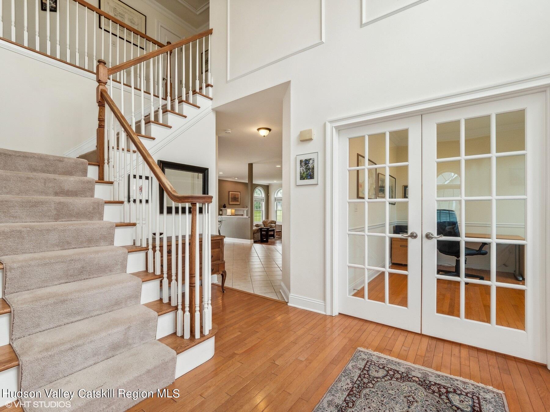 39 Ridgeline Drive Poughkeepsie, NY 12603 - Photo 4 of 35 a view of front door with stairs and wooden floor