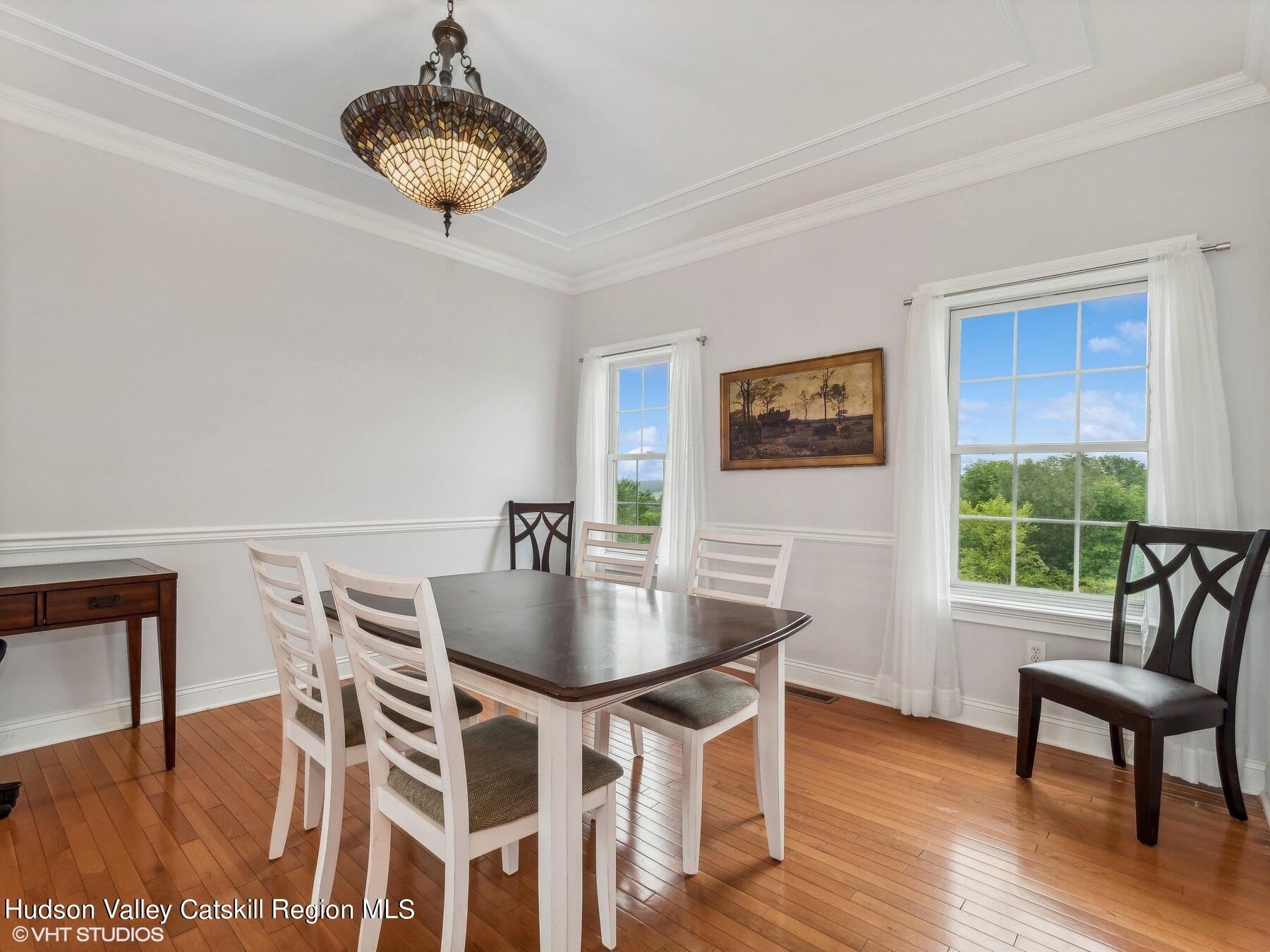 39 Ridgeline Drive Poughkeepsie, NY 12603 - Photo 9 of 35 a view of a dining room with furniture window and wooden floor
