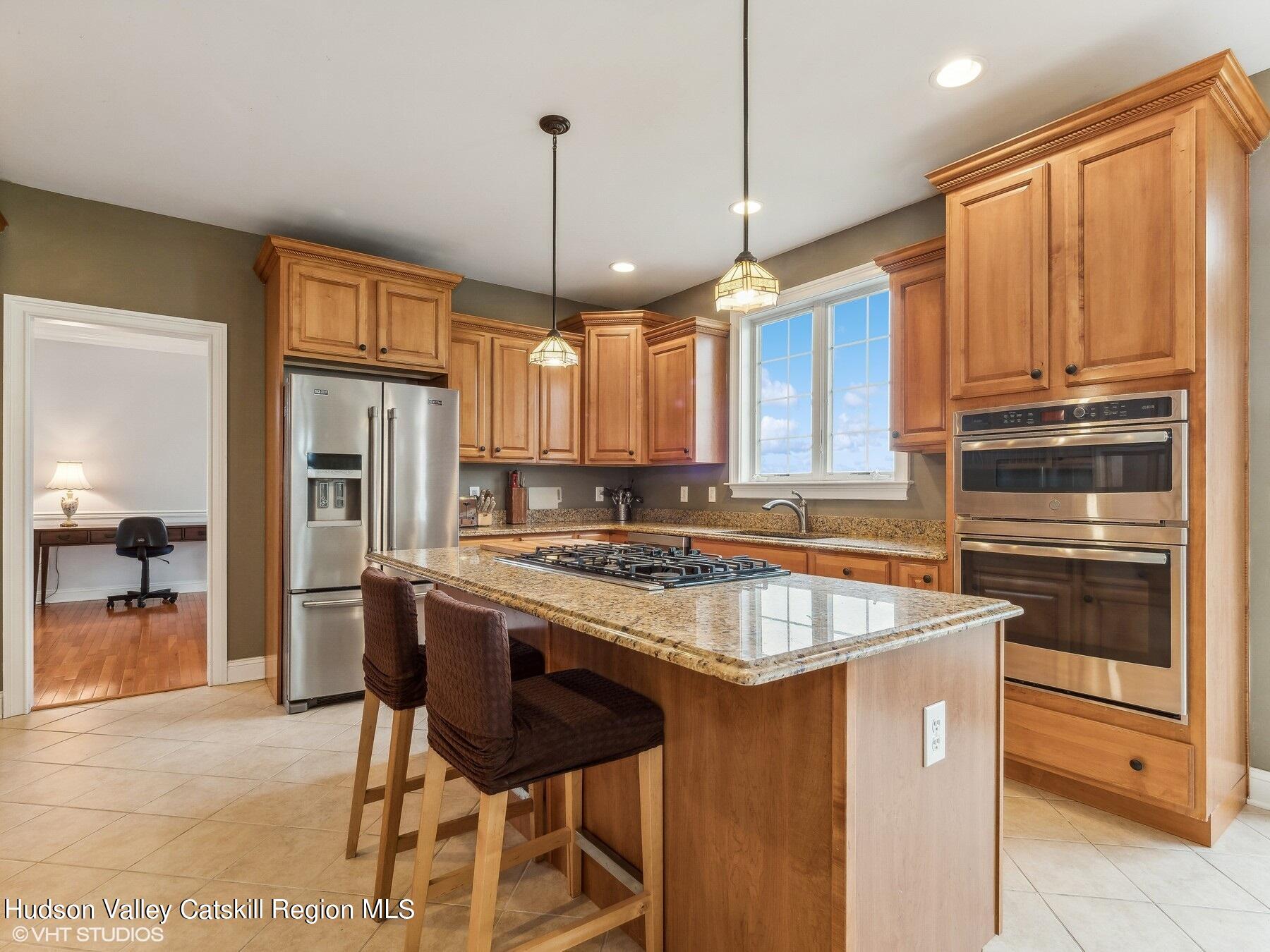 39 Ridgeline Drive Poughkeepsie, NY 12603 - Photo 10 of 35 a kitchen with stainless steel appliances granite countertop a stove a refrigerator and a sink