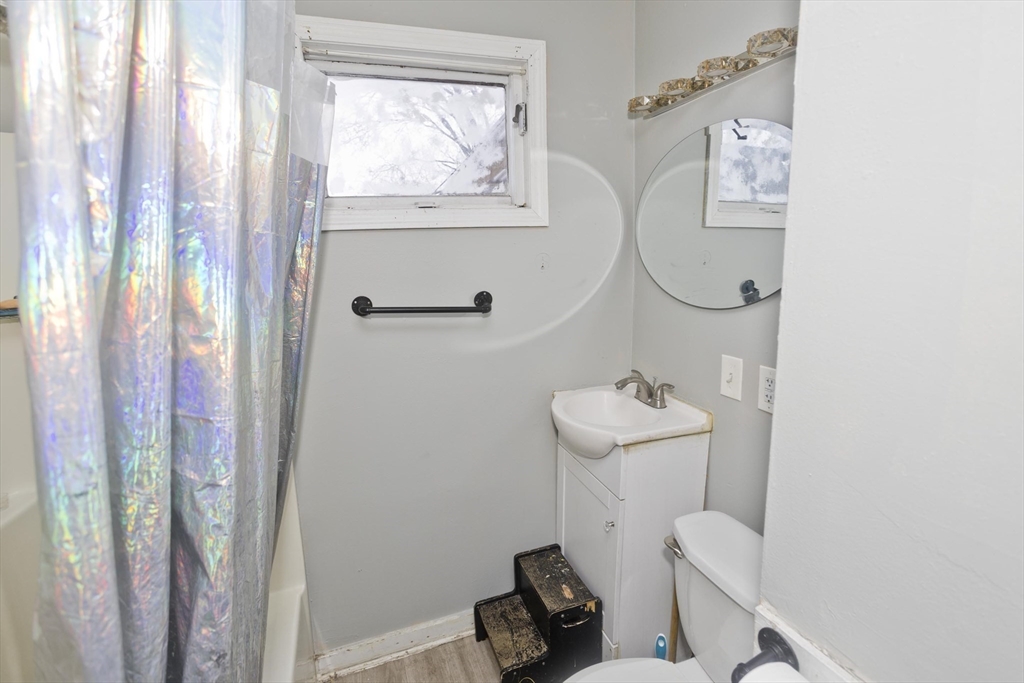 52 Orlando Street Springfield, MA 01108 - Photo 17 of 29 a bathroom with a sink and a mirror