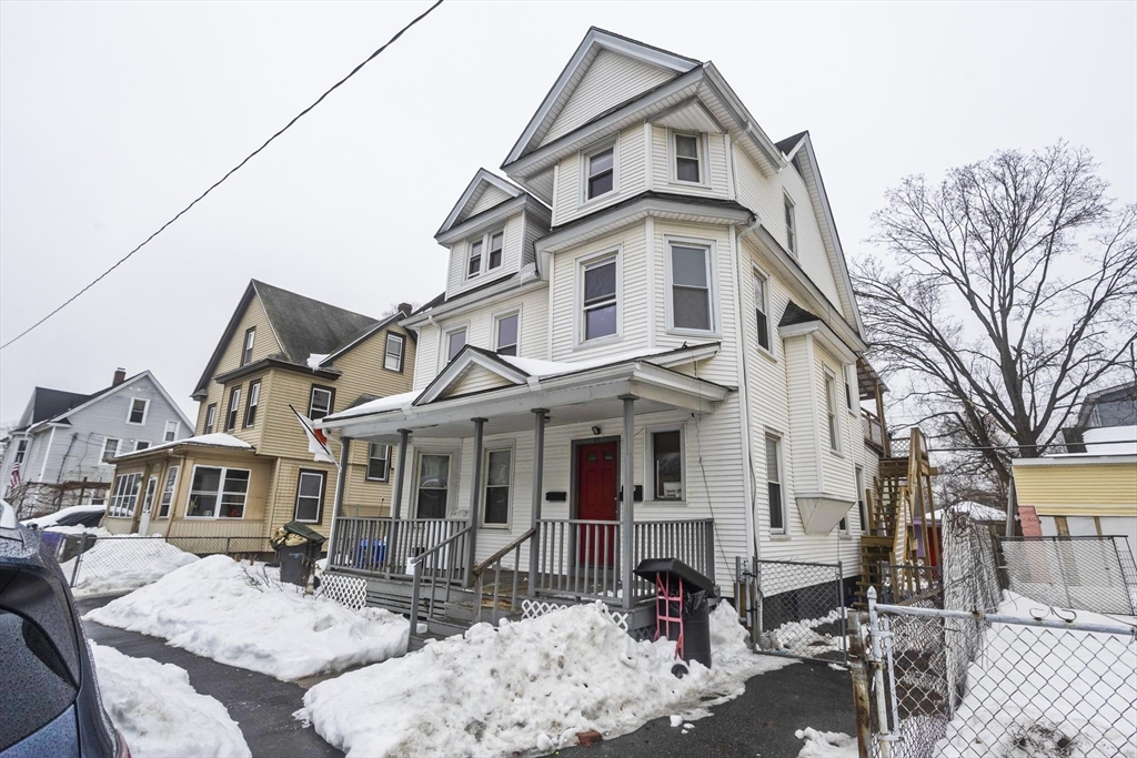 52 Orlando Street Springfield, MA 01108 - Photo 2 of 29 a view of a white house with large windows