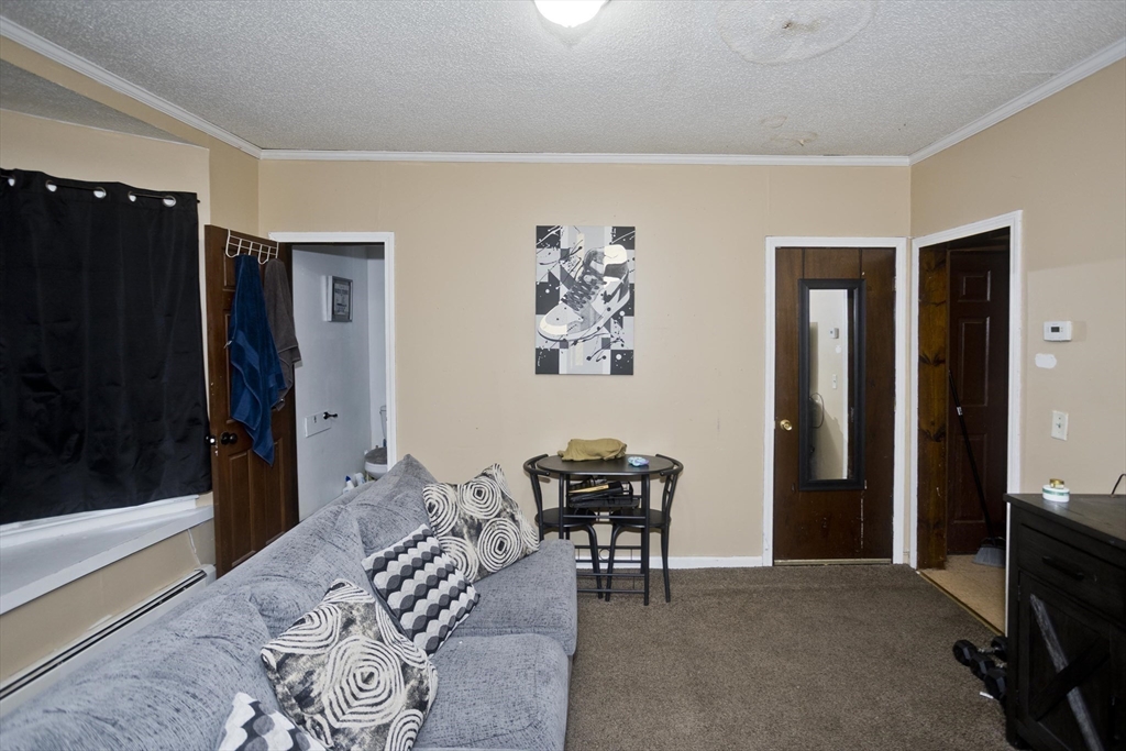 52 Orlando Street Springfield, MA 01108 - Photo 21 of 29 a bedroom with a bed and a desk