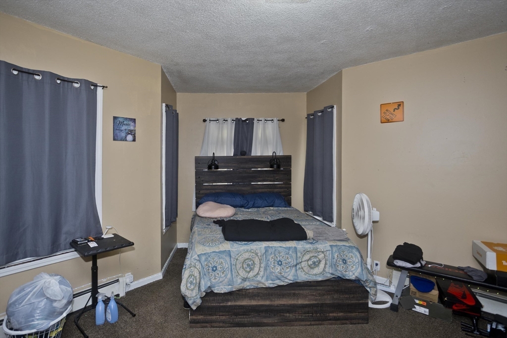 52 Orlando Street Springfield, MA 01108 - Photo 22 of 29 a bedroom with furniture and a window