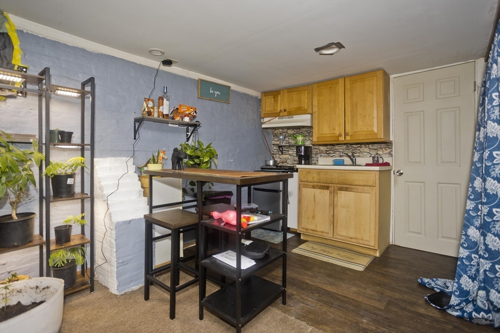 52 Orlando Street Springfield, MA 01108 - Photo 26 of 29 a view of a dining room with a table and chairs