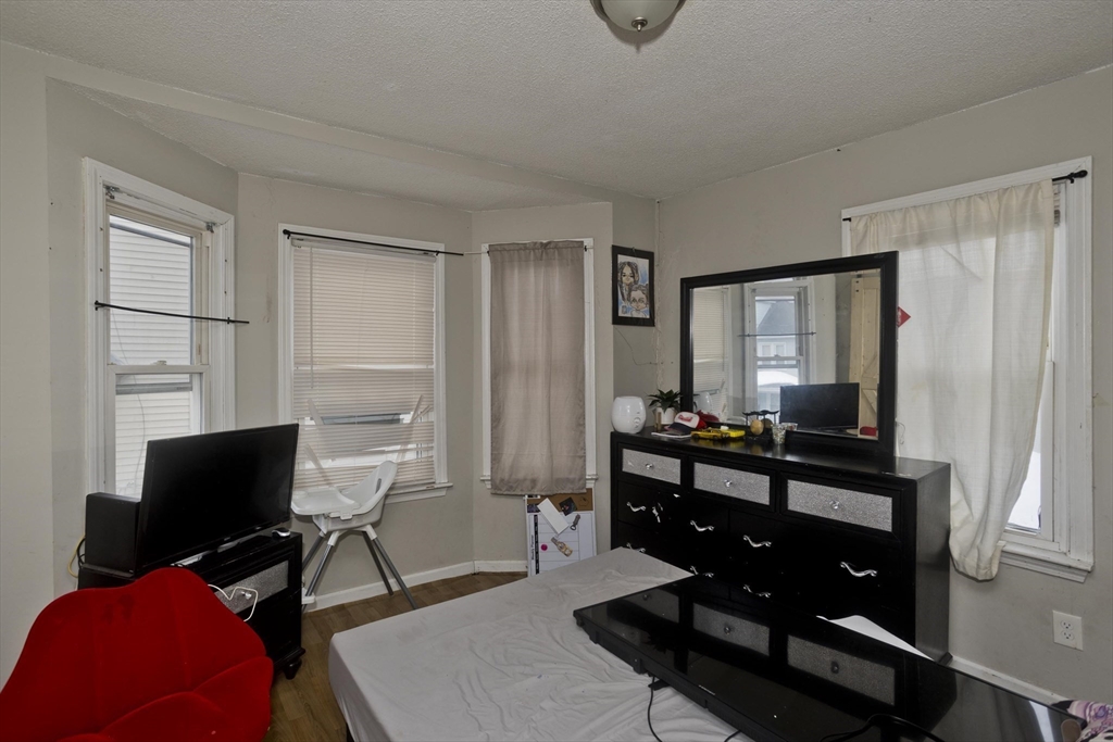 52 Orlando Street Springfield, MA 01108 - Photo 8 of 29 a view of a workspace with furniture and a window