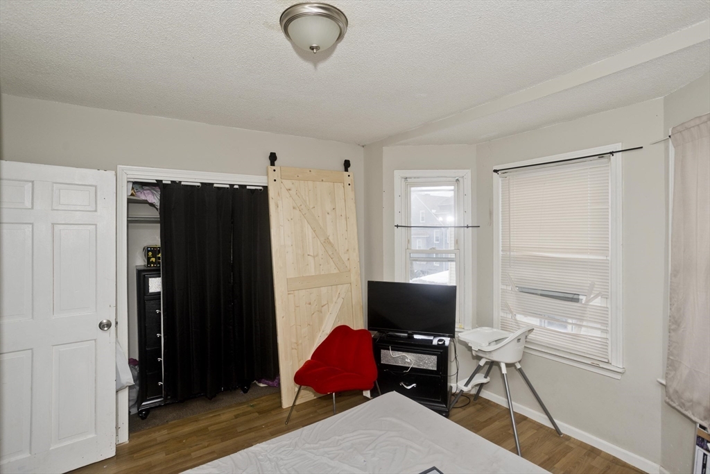 52 Orlando Street Springfield, MA 01108 - Photo 9 of 29 a bedroom with a workspace