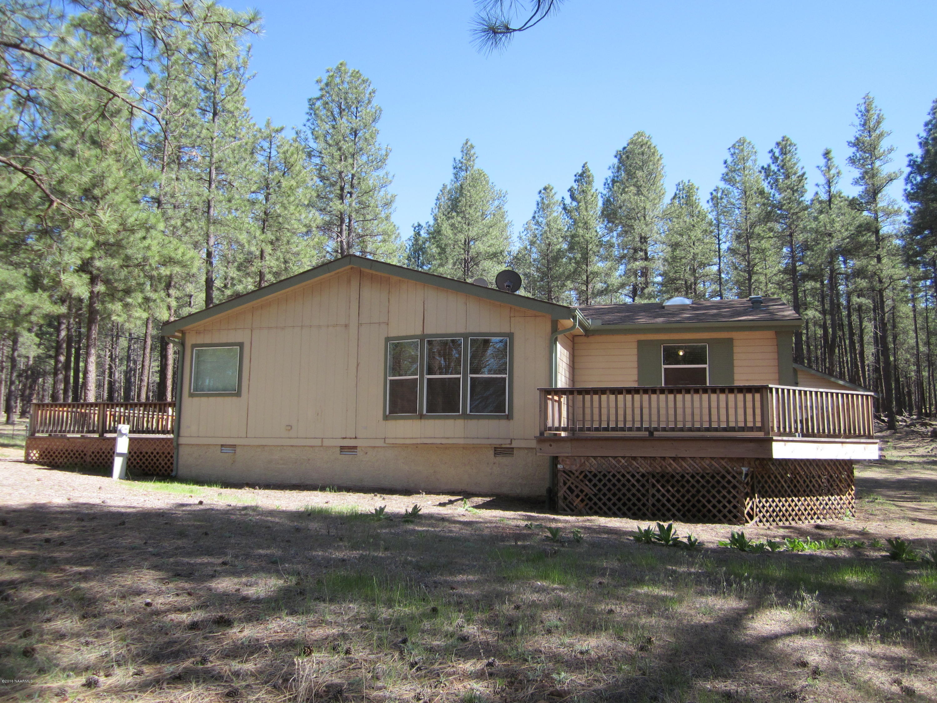 6916 North Spring Valley Road Parks, AZ 86018 - Photo 4 of 29 sideview