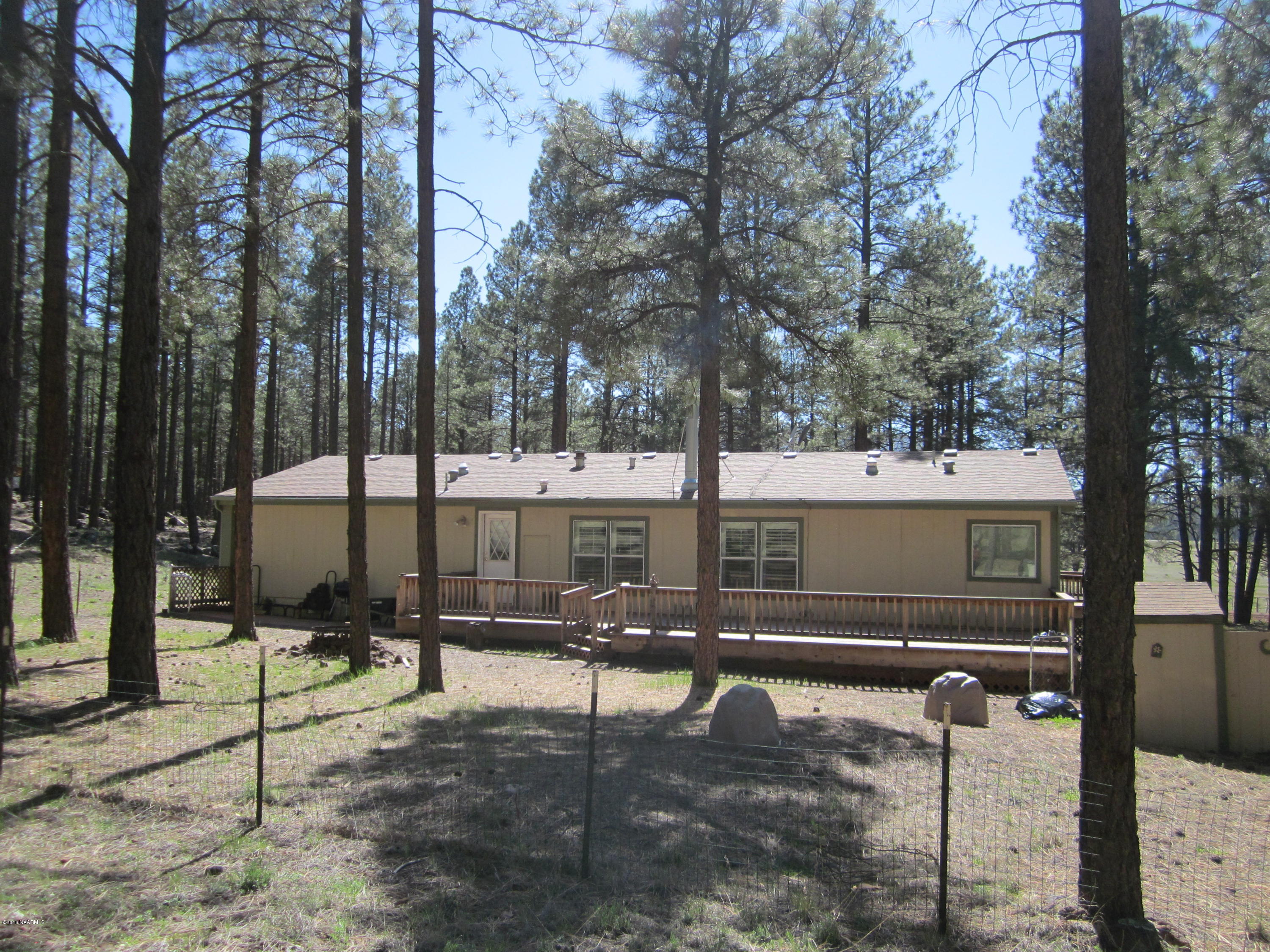 6916 North Spring Valley Road Parks, AZ 86018 - Photo 5 of 29 backview