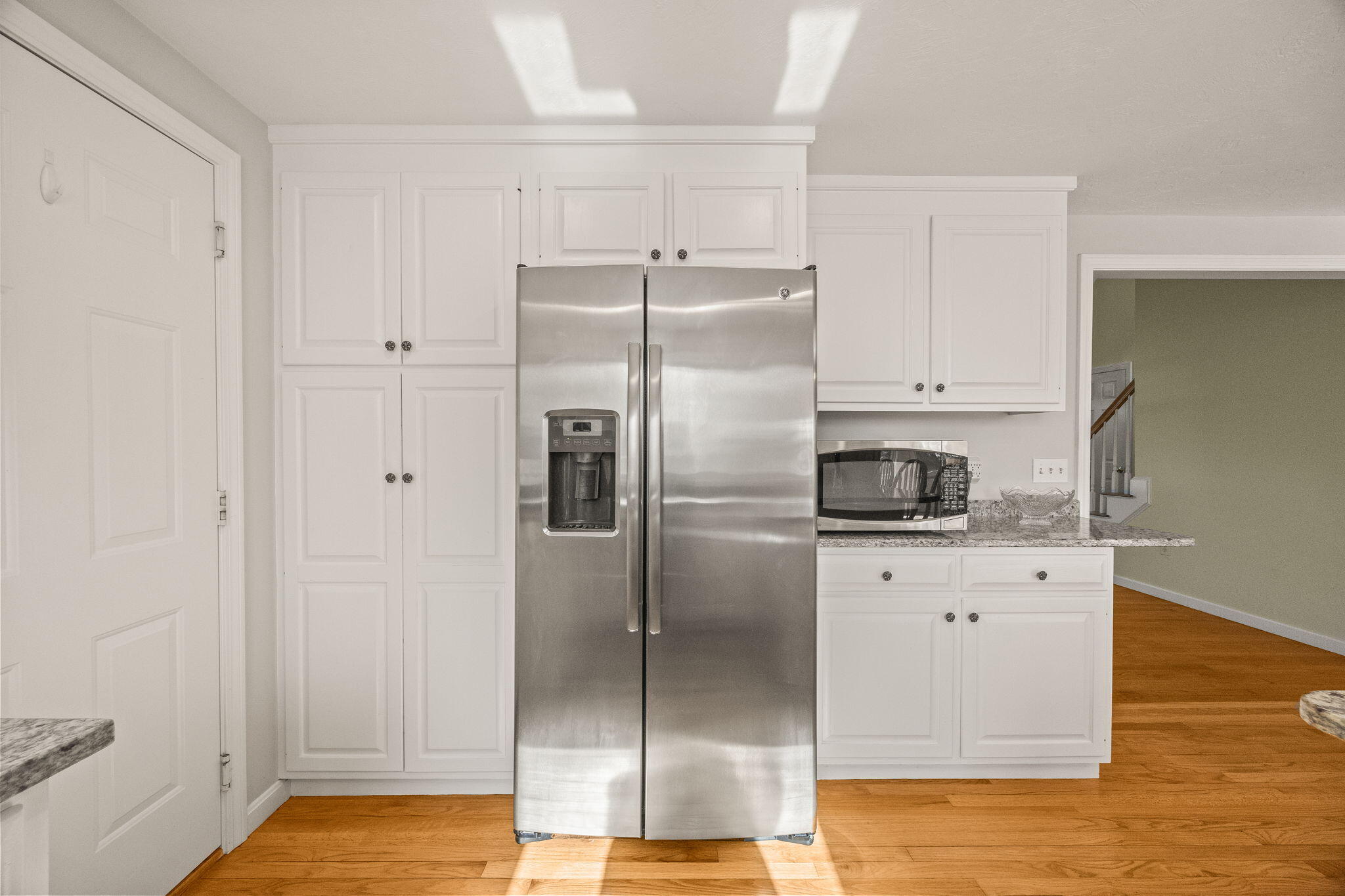 84 Middle Road South Chatham, MA 02659 - Photo 12 of 48 a kitchen with a refrigerator a sink and cabinets