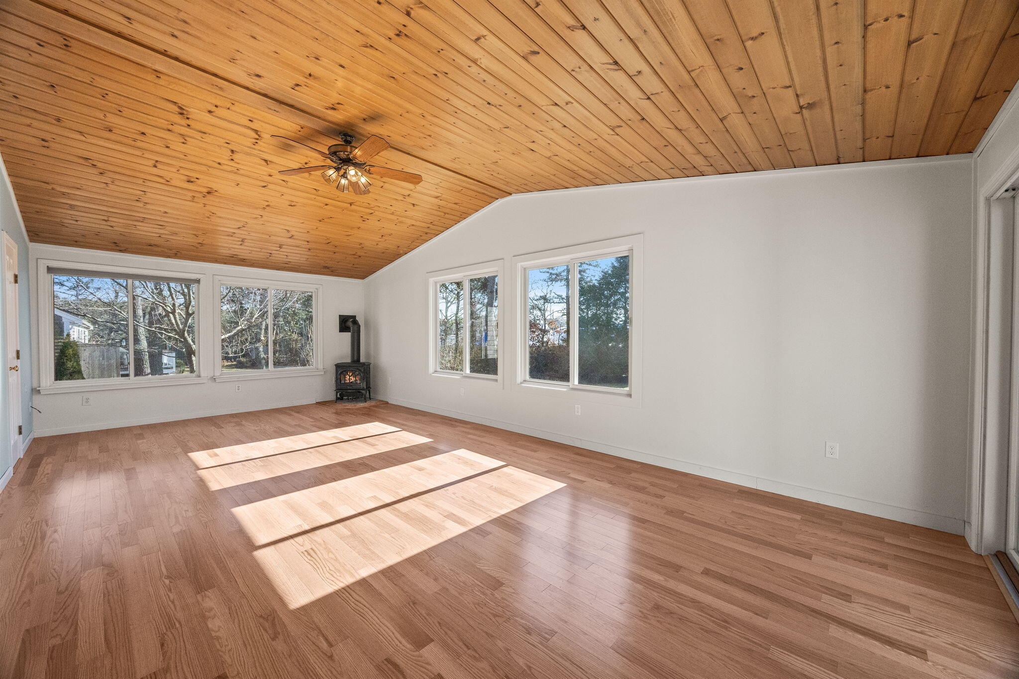 84 Middle Road South Chatham, MA 02659 - Photo 15 of 48 a view of an empty room with wooden floor and a window