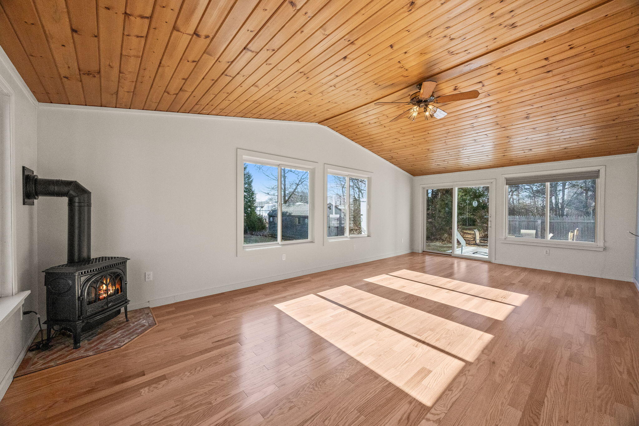 84 Middle Road South Chatham, MA 02659 - Photo 16 of 48 a view of an empty room with wooden floor and a window