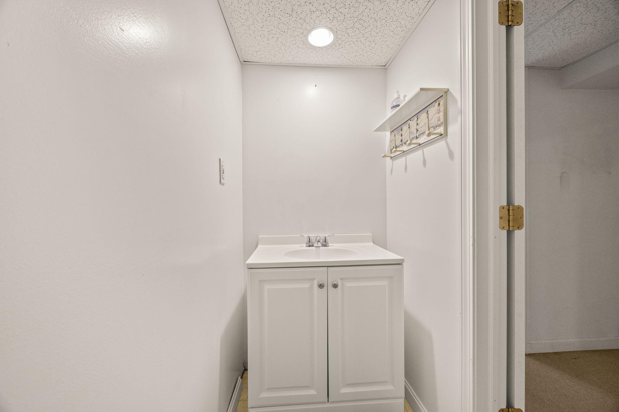 84 Middle Road South Chatham, MA 02659 - Photo 36 of 48 a bathroom with a sink a toilet and mirror