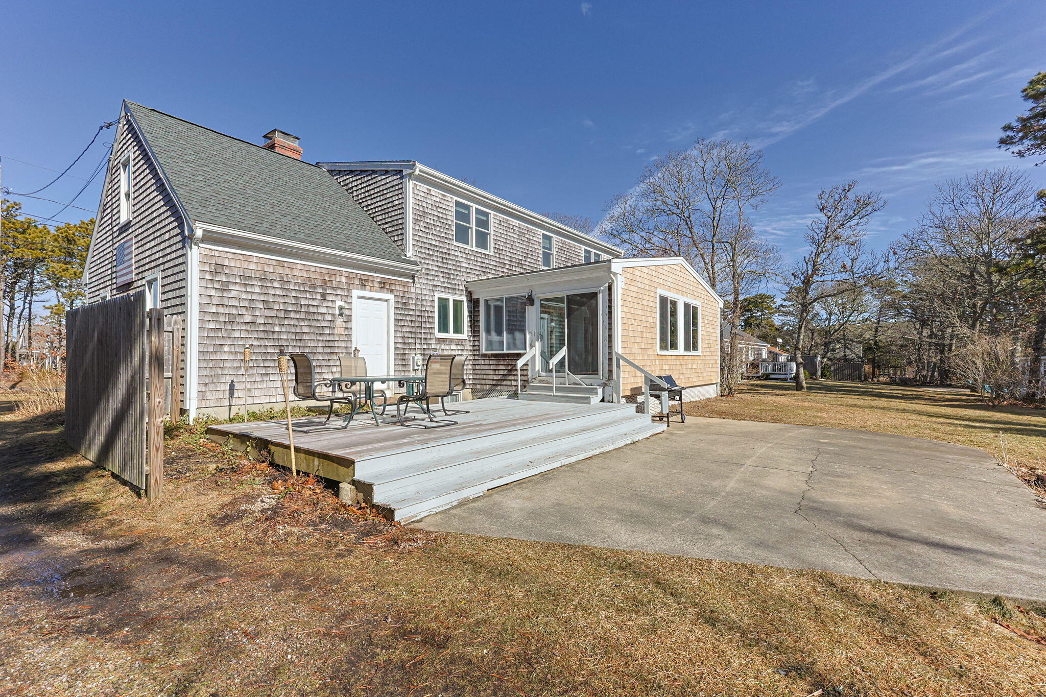 84 Middle Road South Chatham, MA 02659 - Photo 41 of 48 a view of a white house with a swimming pool and sitting area