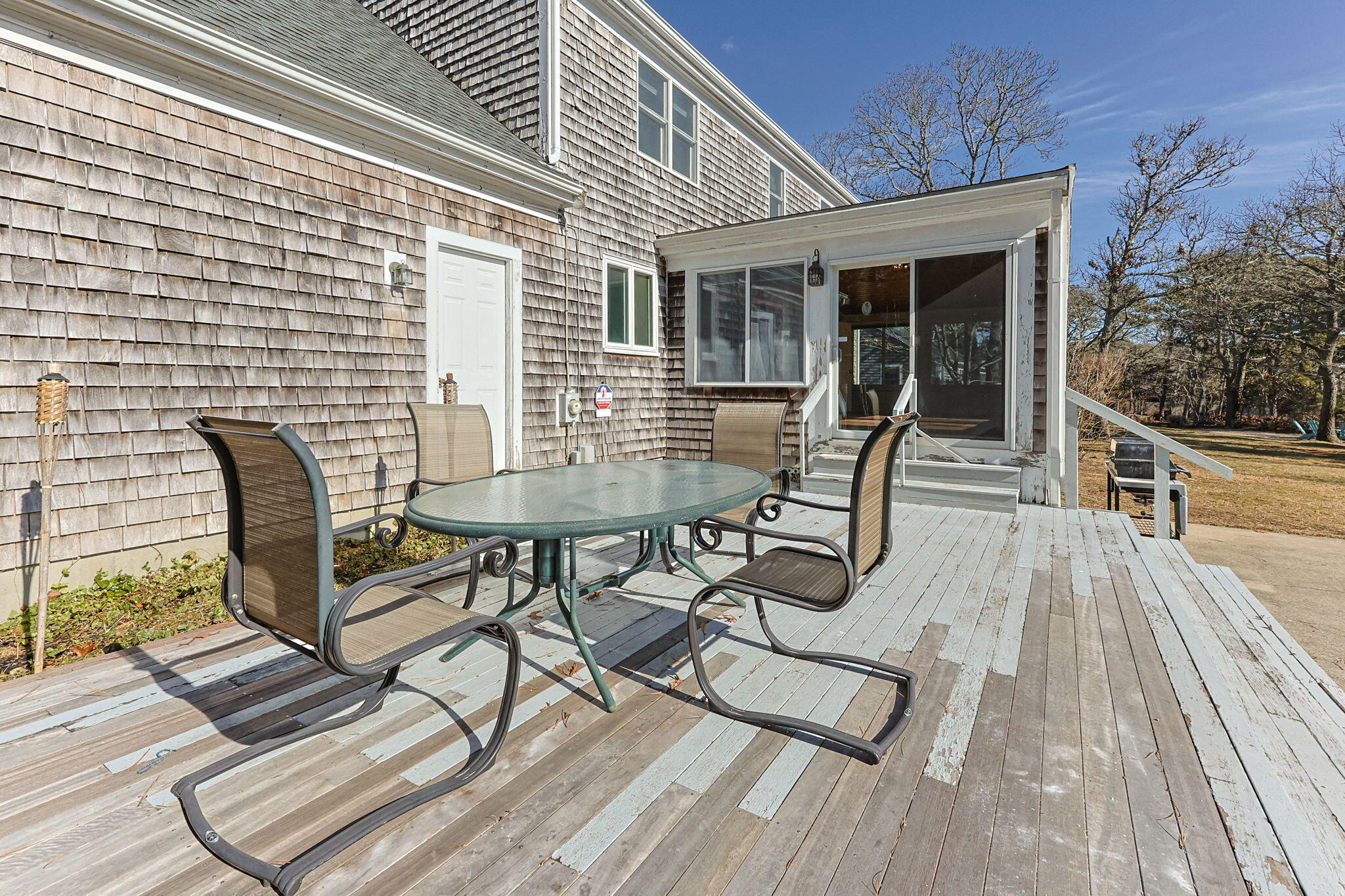 84 Middle Road South Chatham, MA 02659 - Photo 45 of 48 a view of a patio with table and chairs and wooden floor