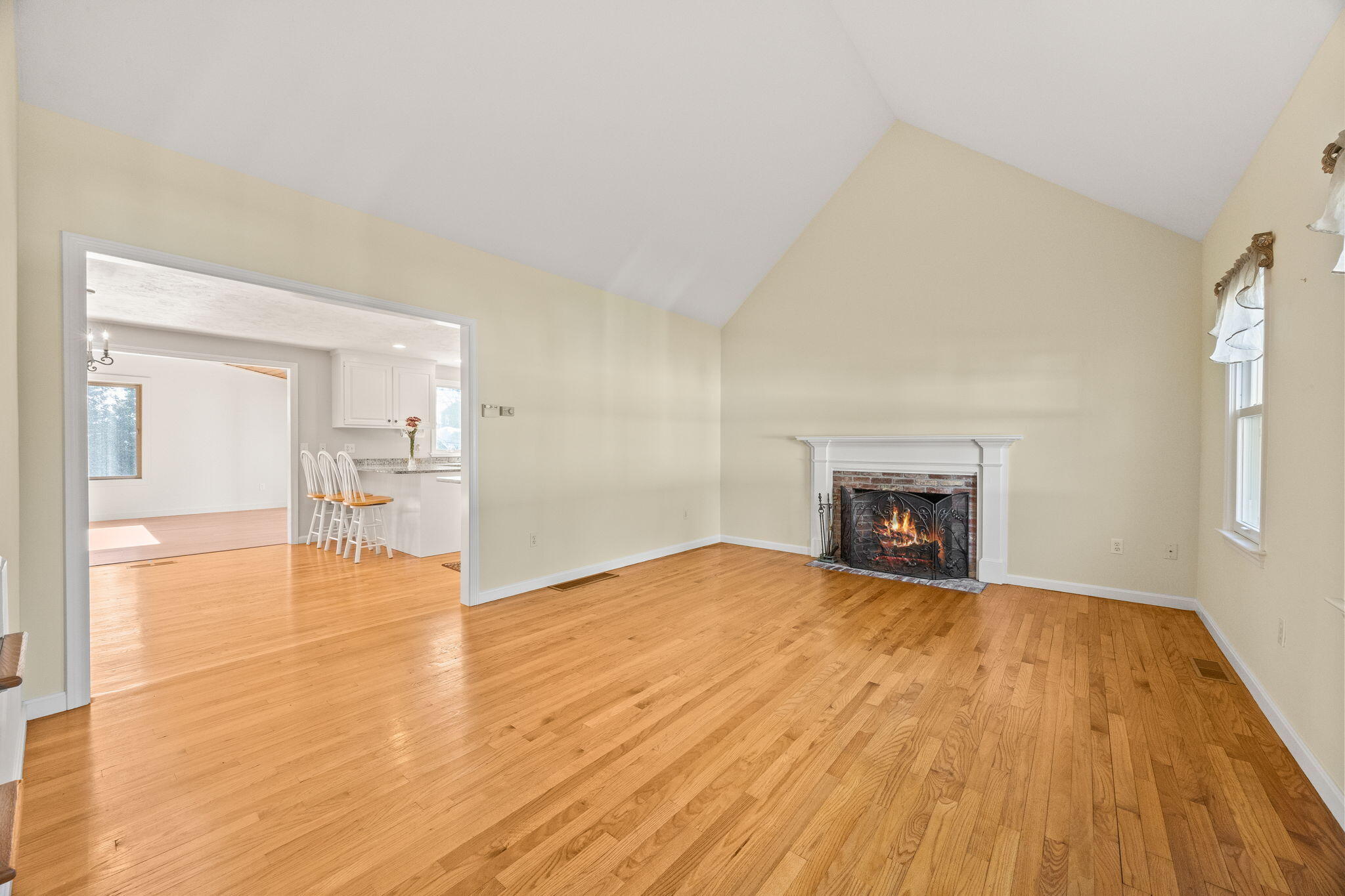 84 Middle Road South Chatham, MA 02659 - Photo 6 of 48 a view of empty room with wooden floor and fireplace