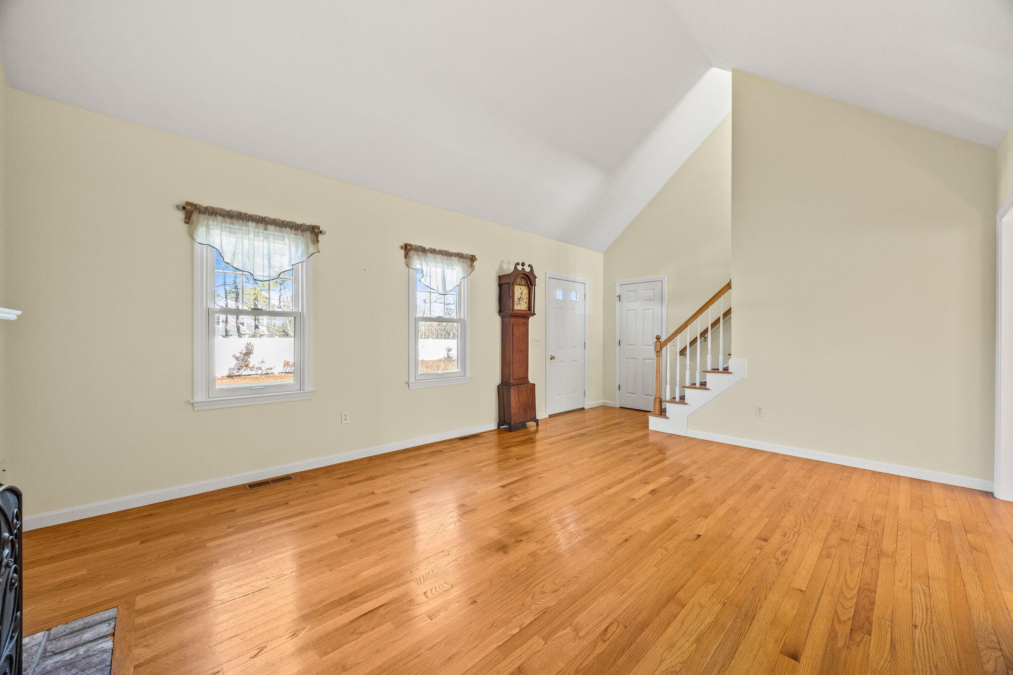 84 Middle Road South Chatham, MA 02659 - Photo 7 of 48 a view of an empty room with wooden floor and a window