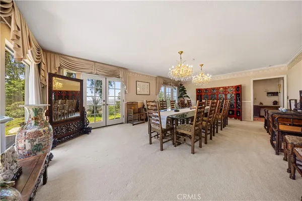 a kitchen with stainless steel appliances granite countertop a sink a stove and a wooden floors